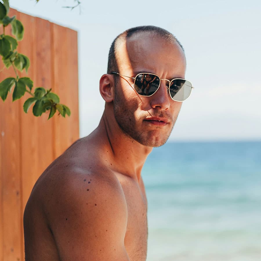 man wearing shades in the beach